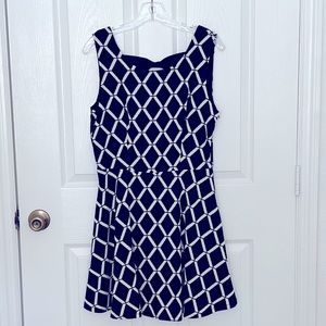 Navy blue tank dress with open bow back.